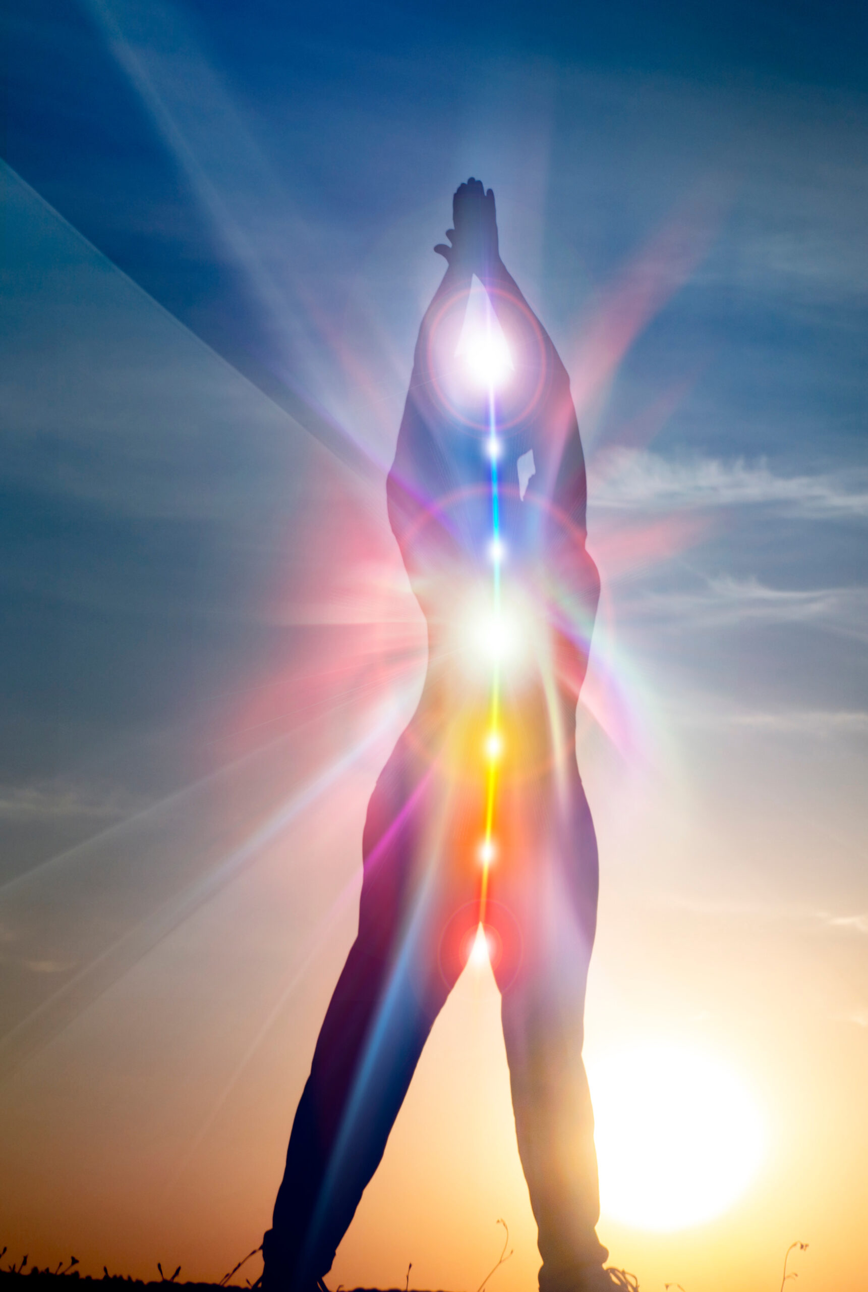 woman in yoga pose on beach sunset view, glowing seven all chakra. Kundalini energy. girl practicing meditation outdoors. Silhouette.